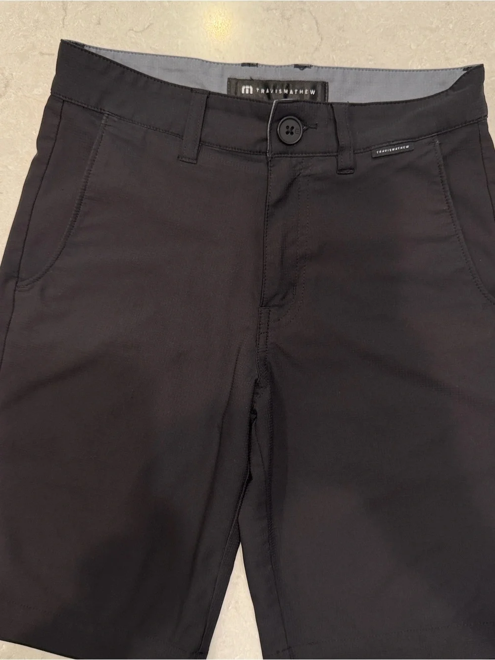Travis Mathew Black Wanderlust junior golf shorts